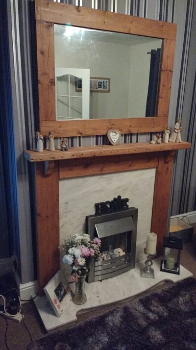 Wooden fire surround, shelves and mirrors made to order.