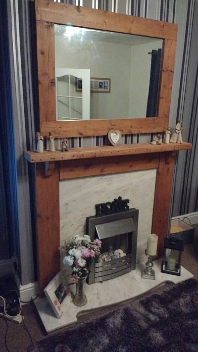 Wooden fire surround, shelves and mirrors made to order.
